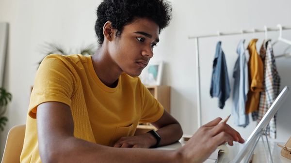A student filling out paperwork
