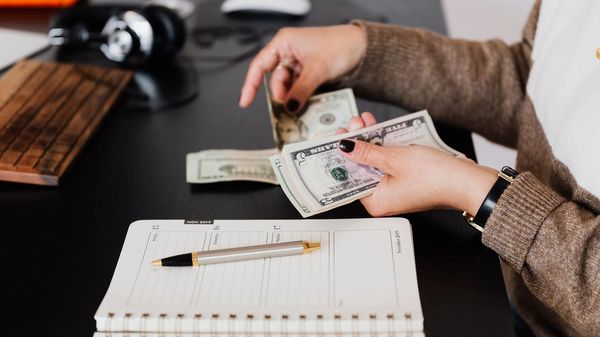A financial planner counting money